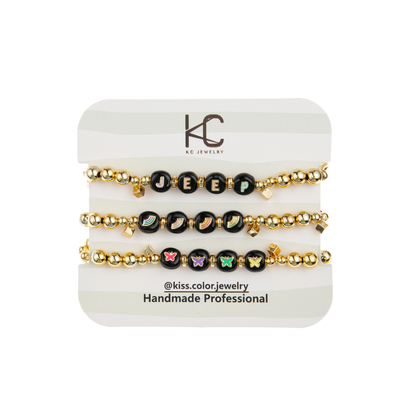 KCの金の赤鉄鉱のアルファベットの手紙のブレスレットの黒の虹の合金材料